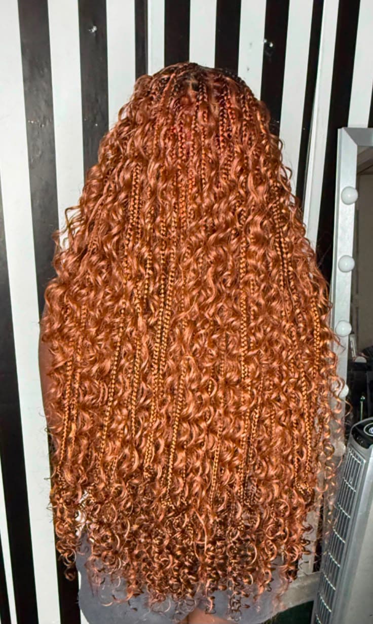 Copper Borabora braids with defined curls, worn long